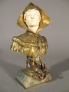 A French ivory and gilt bronze buste of a woman with onyx base, by E. Bernoud, dated 1902, Height 24.5cm